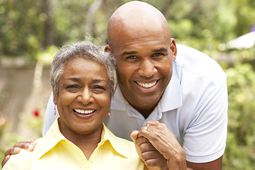 African american mother and son outside smiling at the camera