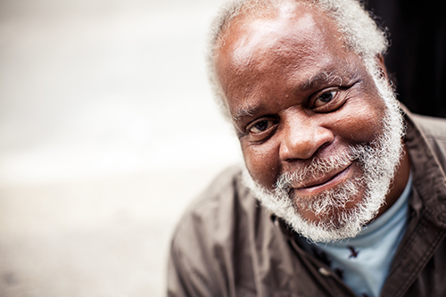 Close up of african american man with a white beard smiling 